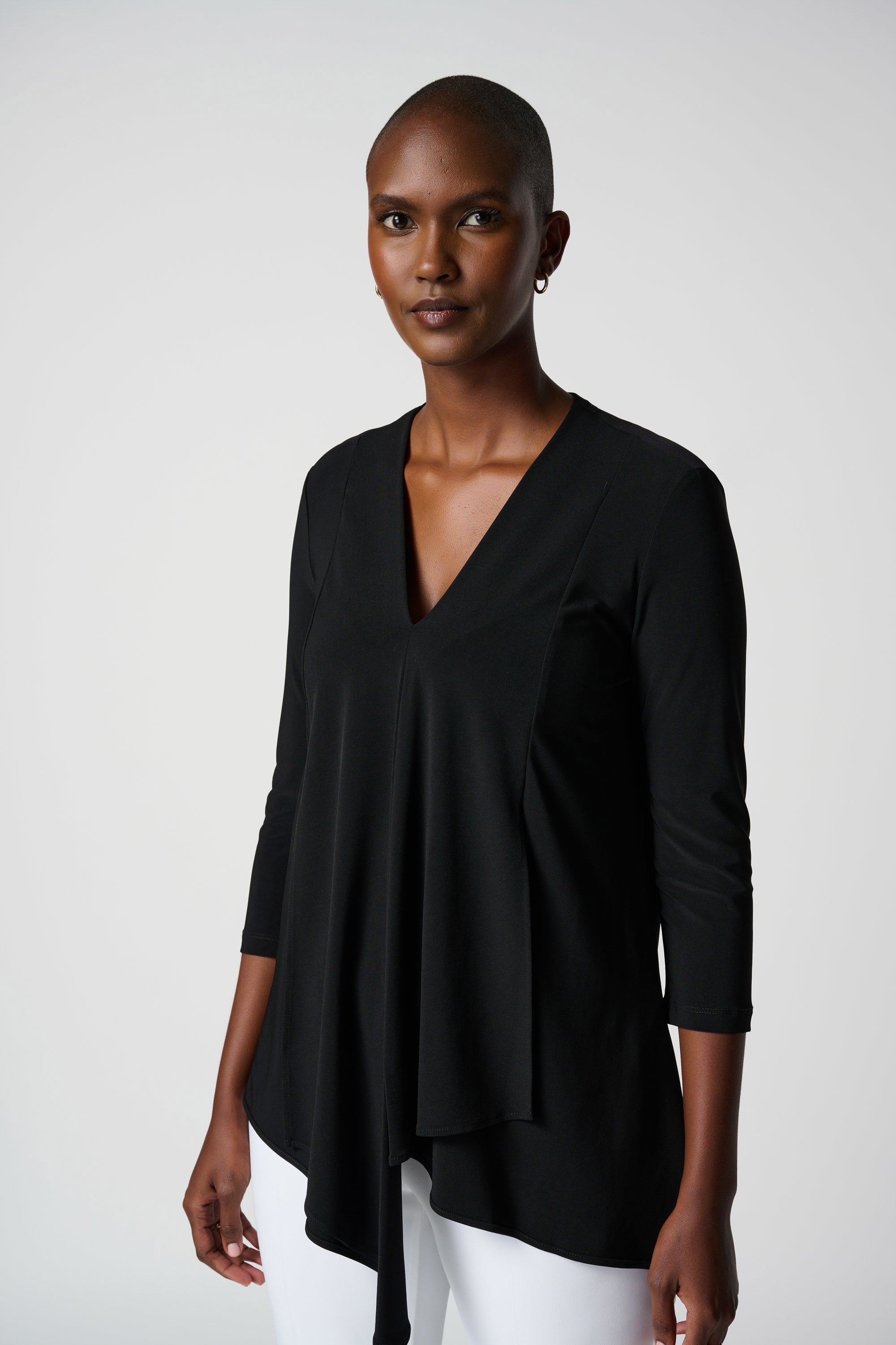 Front image of Joseph Ribkoff asymmetrical hem tunic in black.