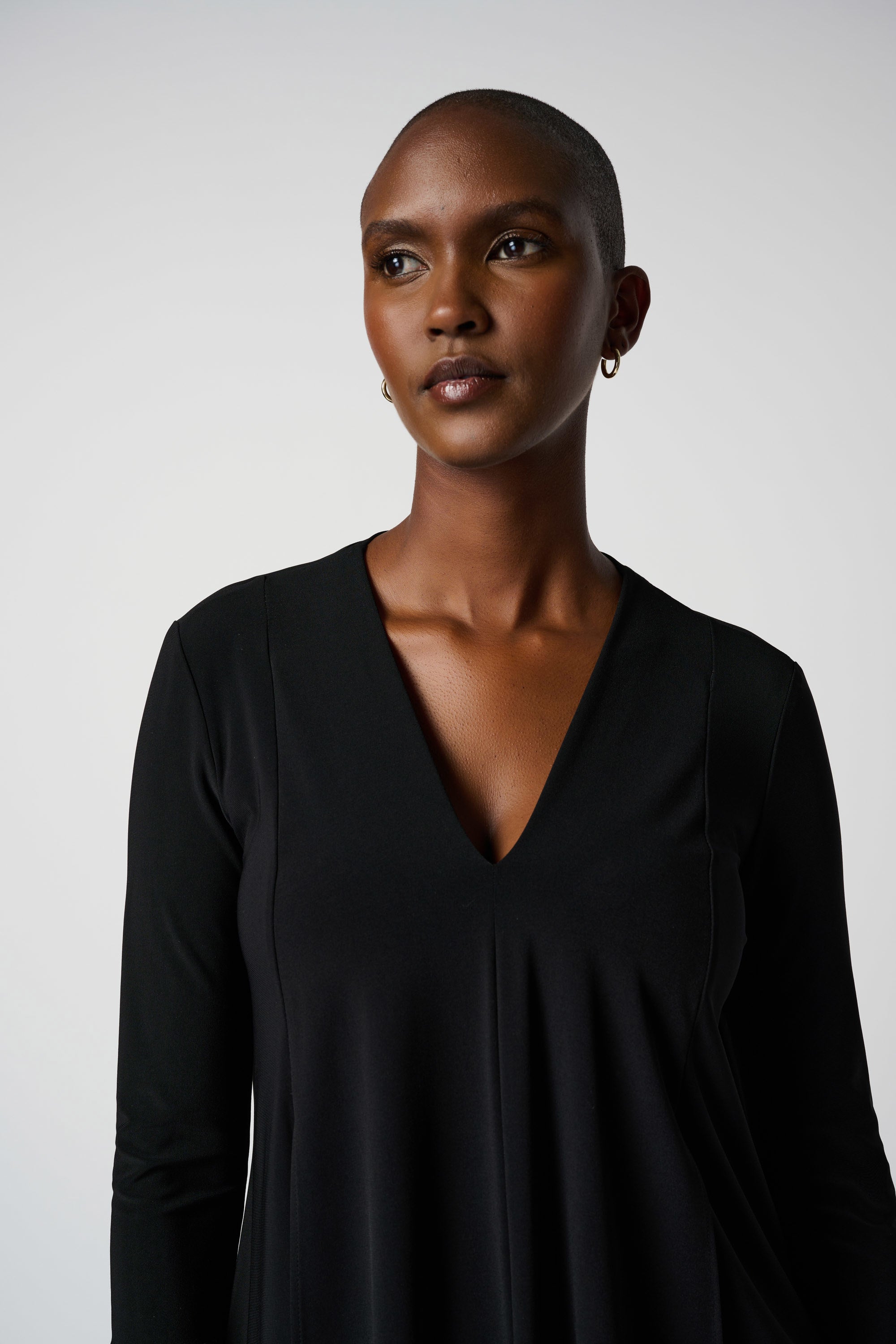 Front image of Joseph Ribkoff asymmetrical hem tunic in black.