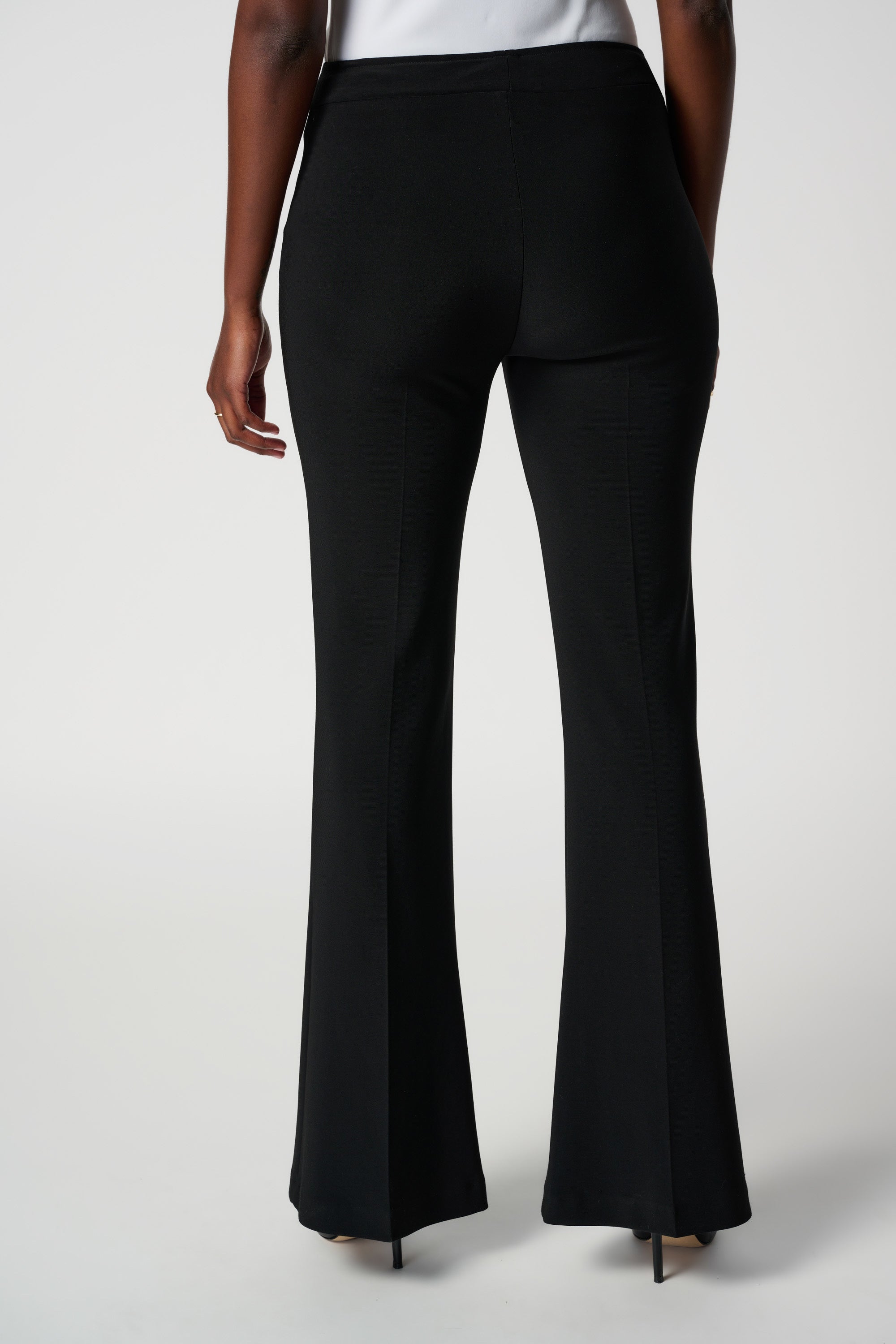 Back image of Joseph Ribkoff classic flared pants in black.