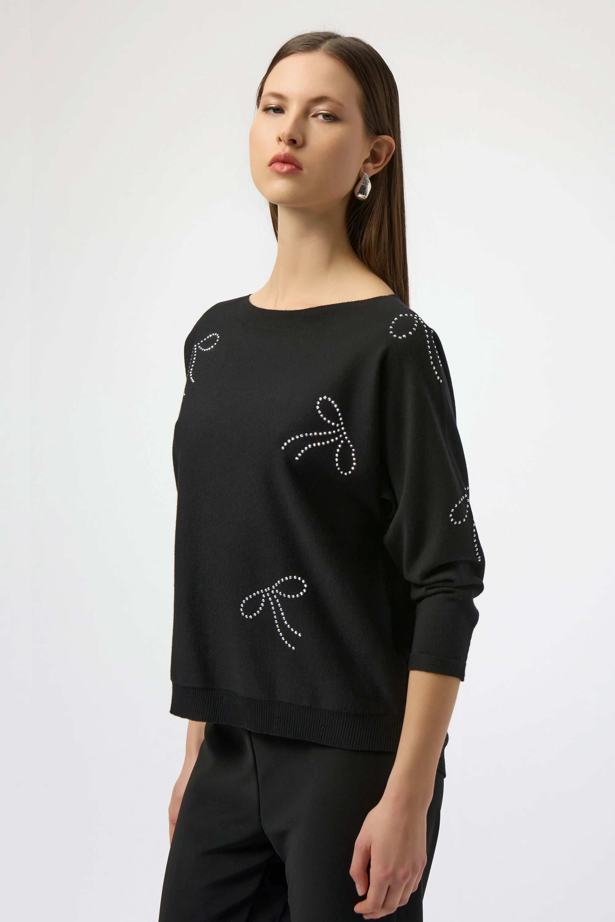Front View Image of Joseph Ribkoff Sweater Knit Pullover with Iron-On Bow Detail in Black