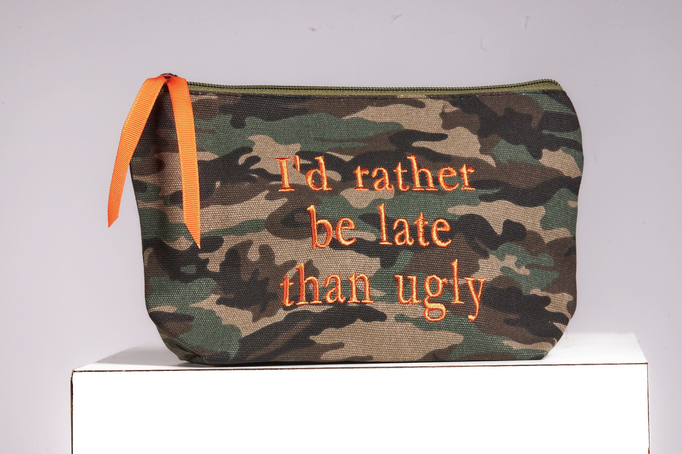 Front image of cosmetic case. I'd rather be late than ugly.