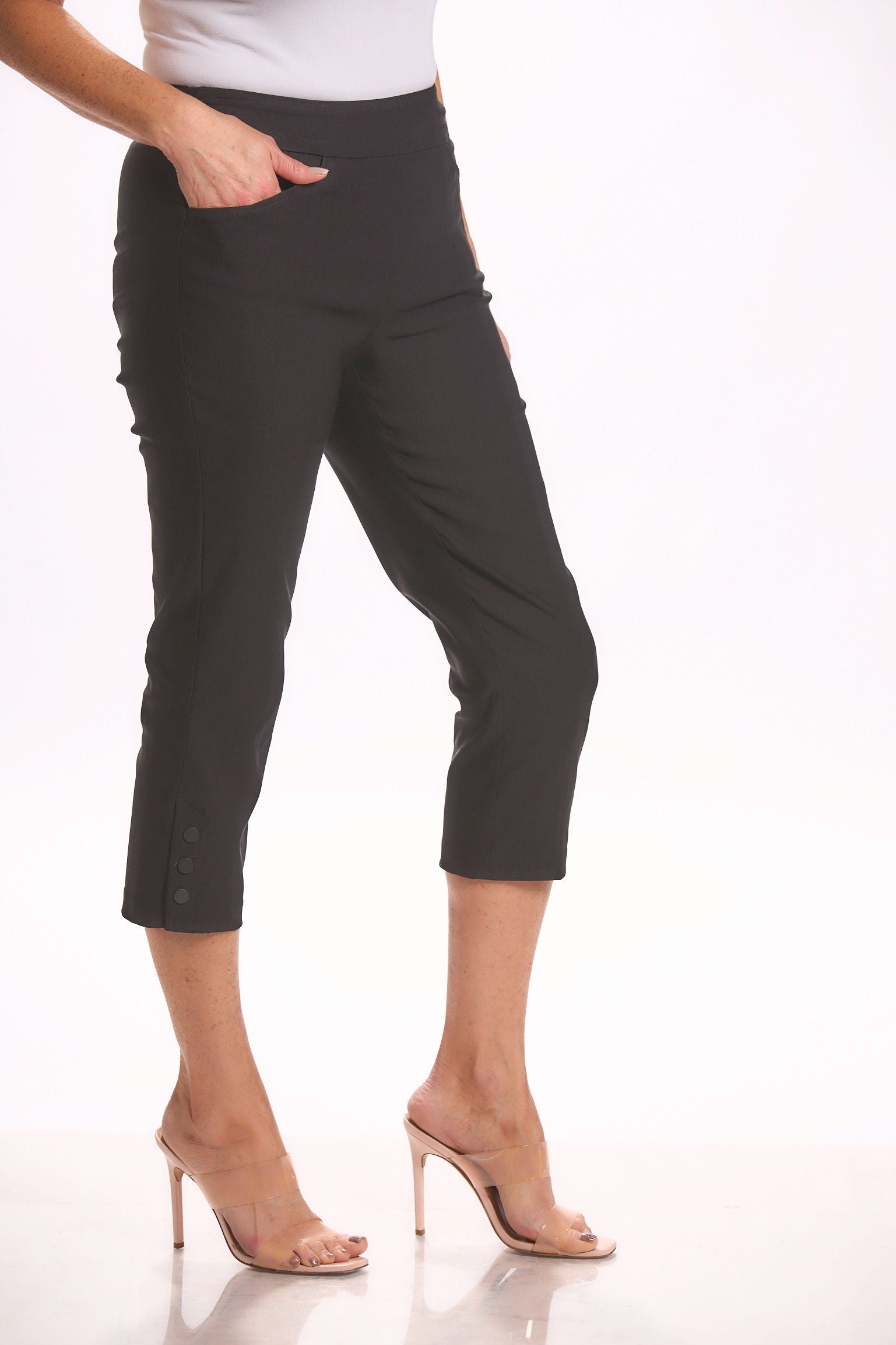 Side image of Tribal pull on black capri bottoms with side snap. Black basic everyday bottoms.