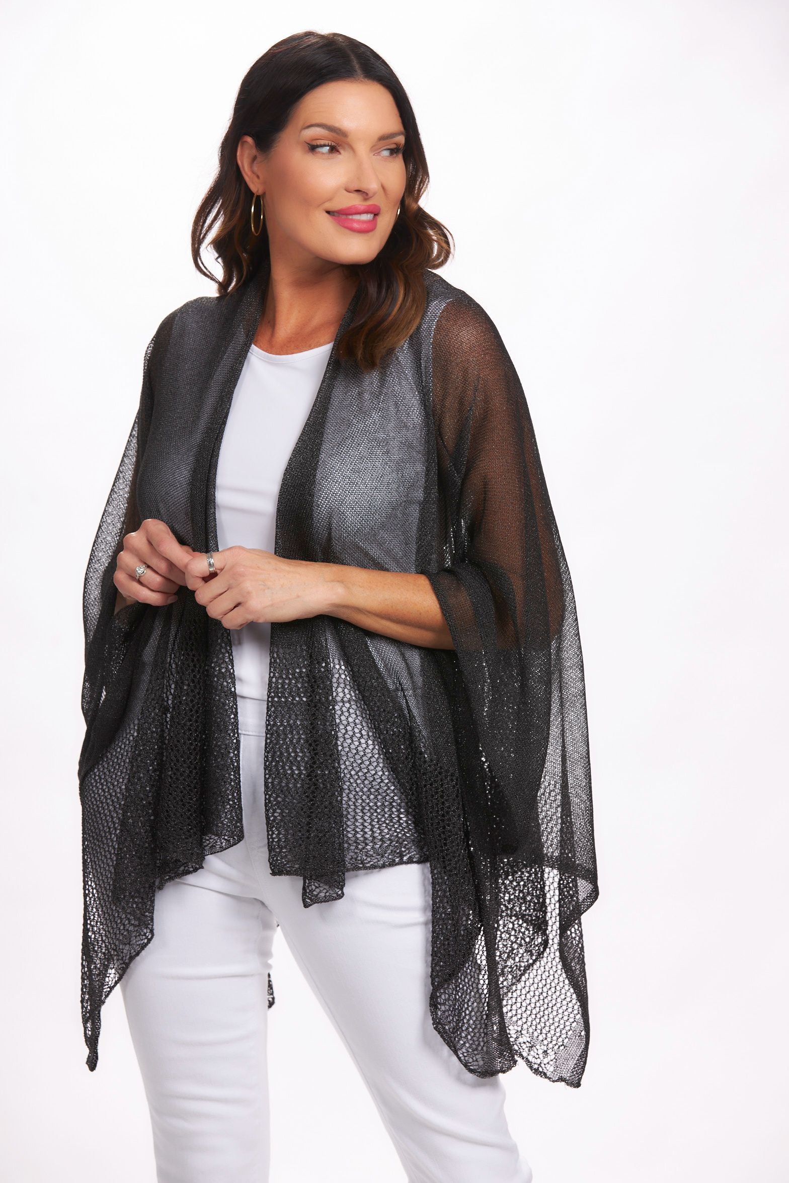 Front image of black lightweight knit ruana shawl. Black layering shawl.