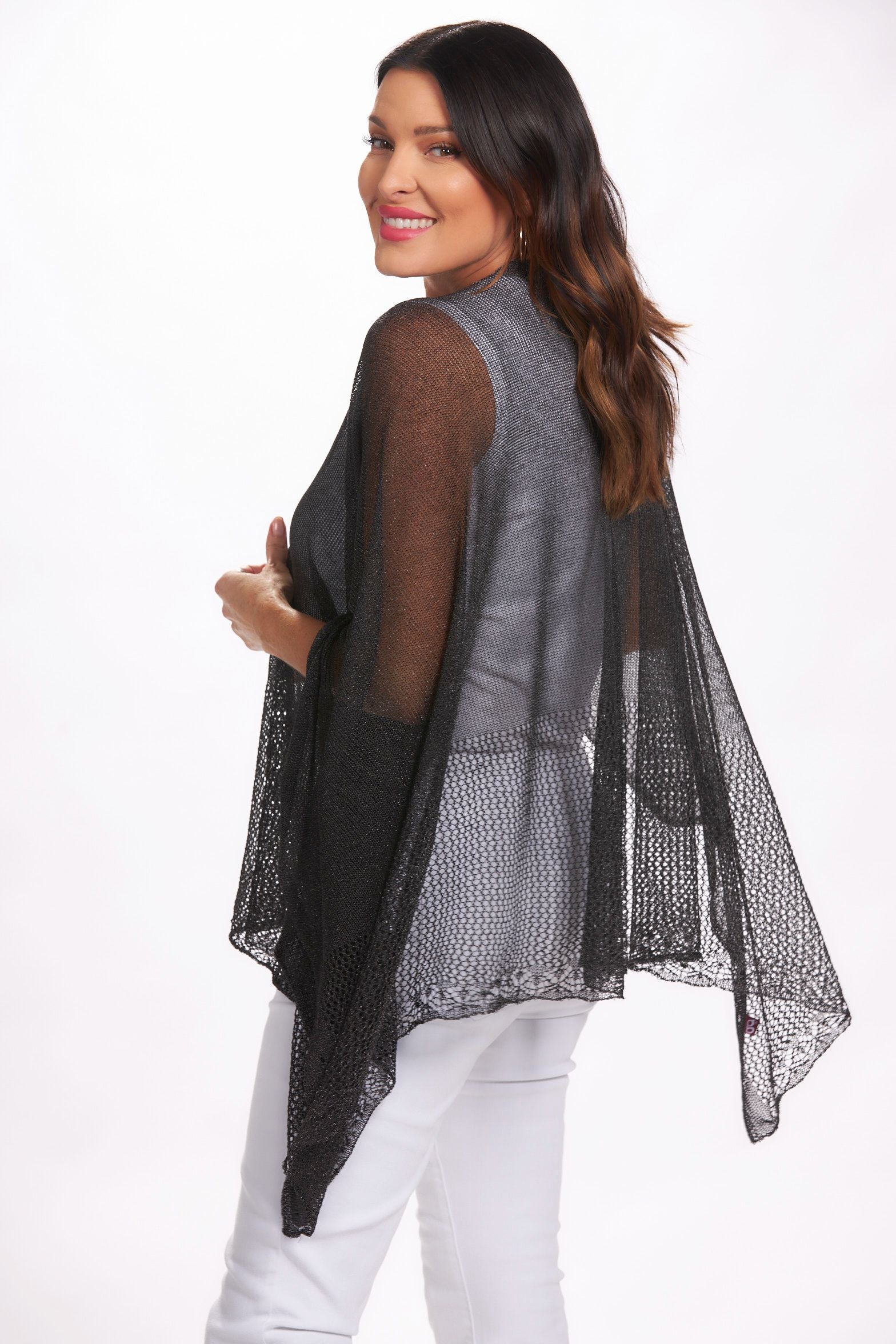 Side image of black lightweight knit ruana shawl. Black layering shawl.