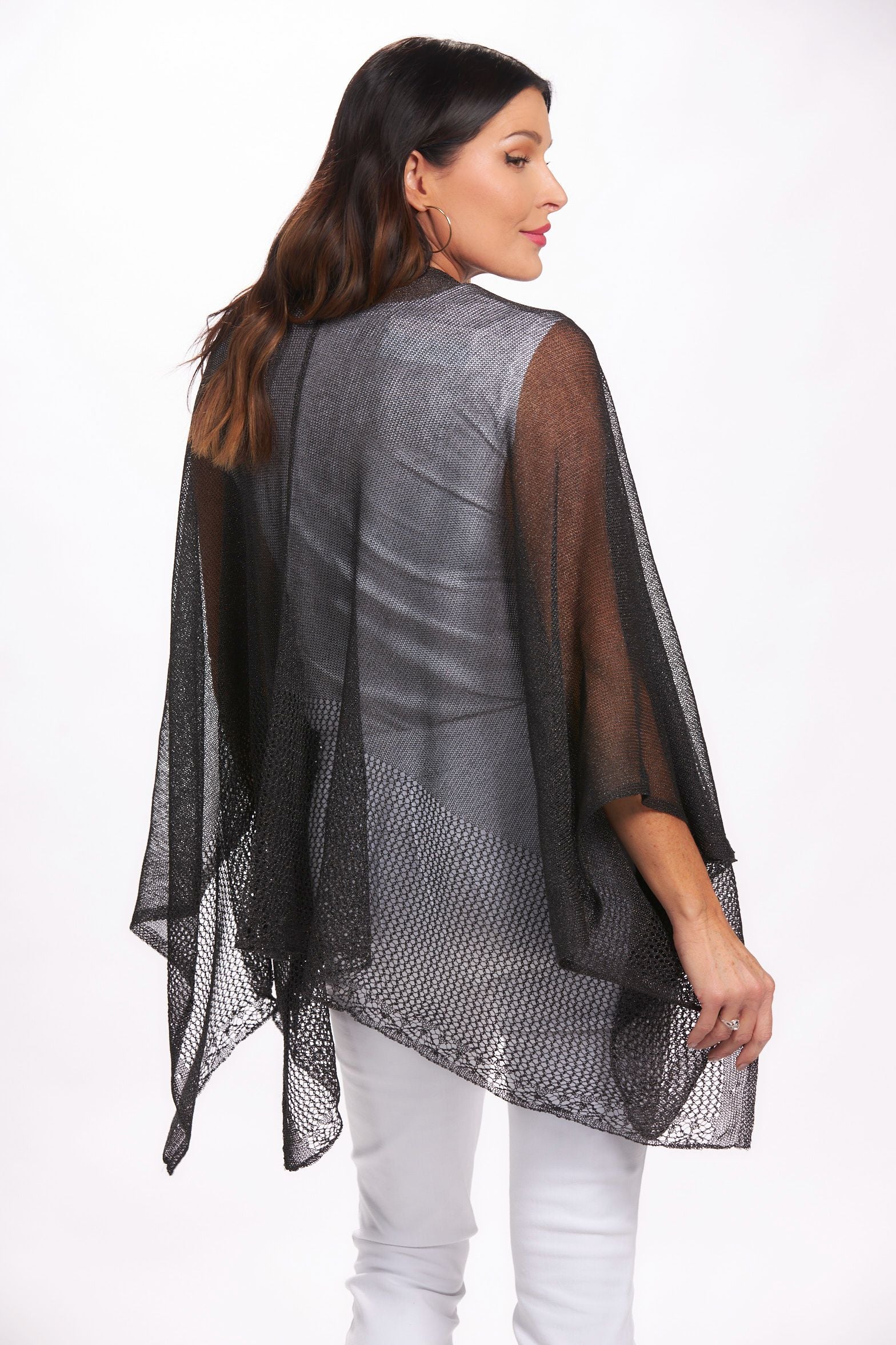 Back image of black lightweight knit ruana shawl. Black layering shawl.