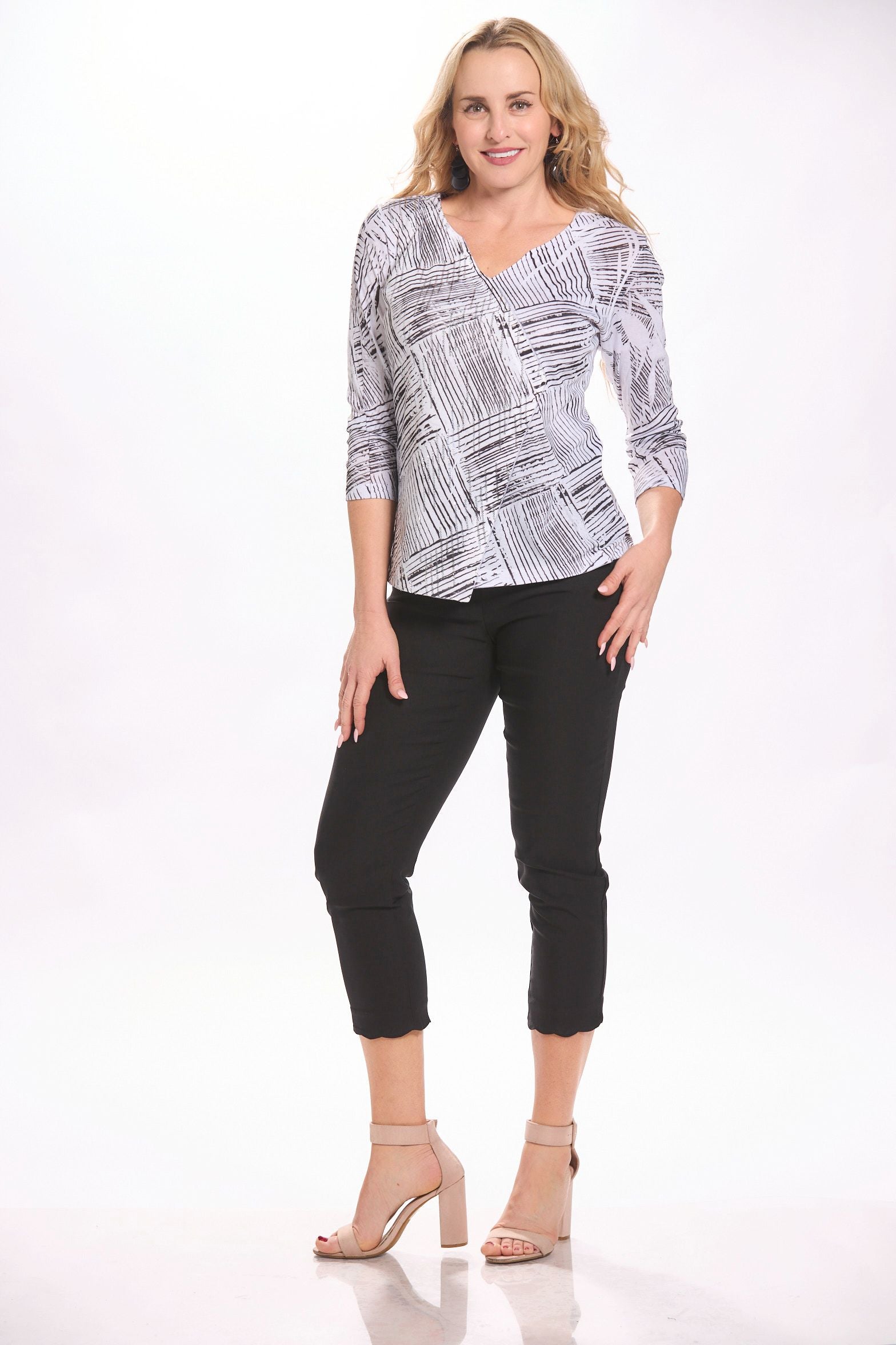 Front image of tribal black scallop pants. Pull on black capri bottoms.