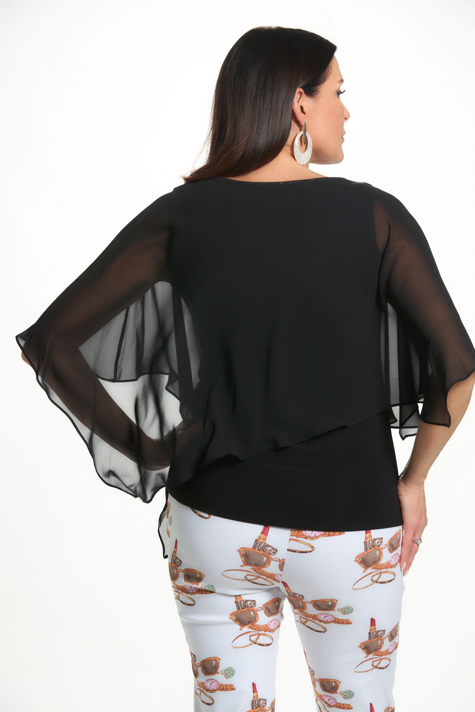 Back image of last tango black chiffon asymmetrical top.