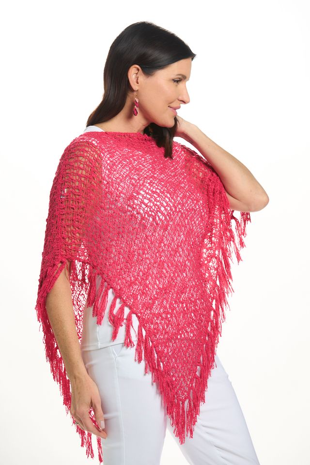 Side image of lost river fringe popcorn poncho in hot pink.