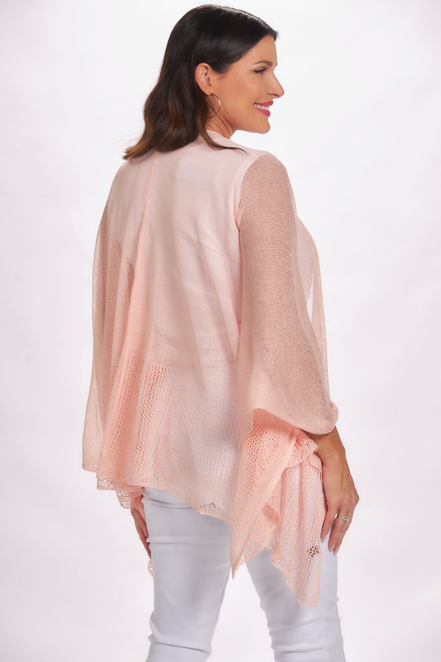 Side image of the magic scarf company lightweight ruana. Light pink shawl.