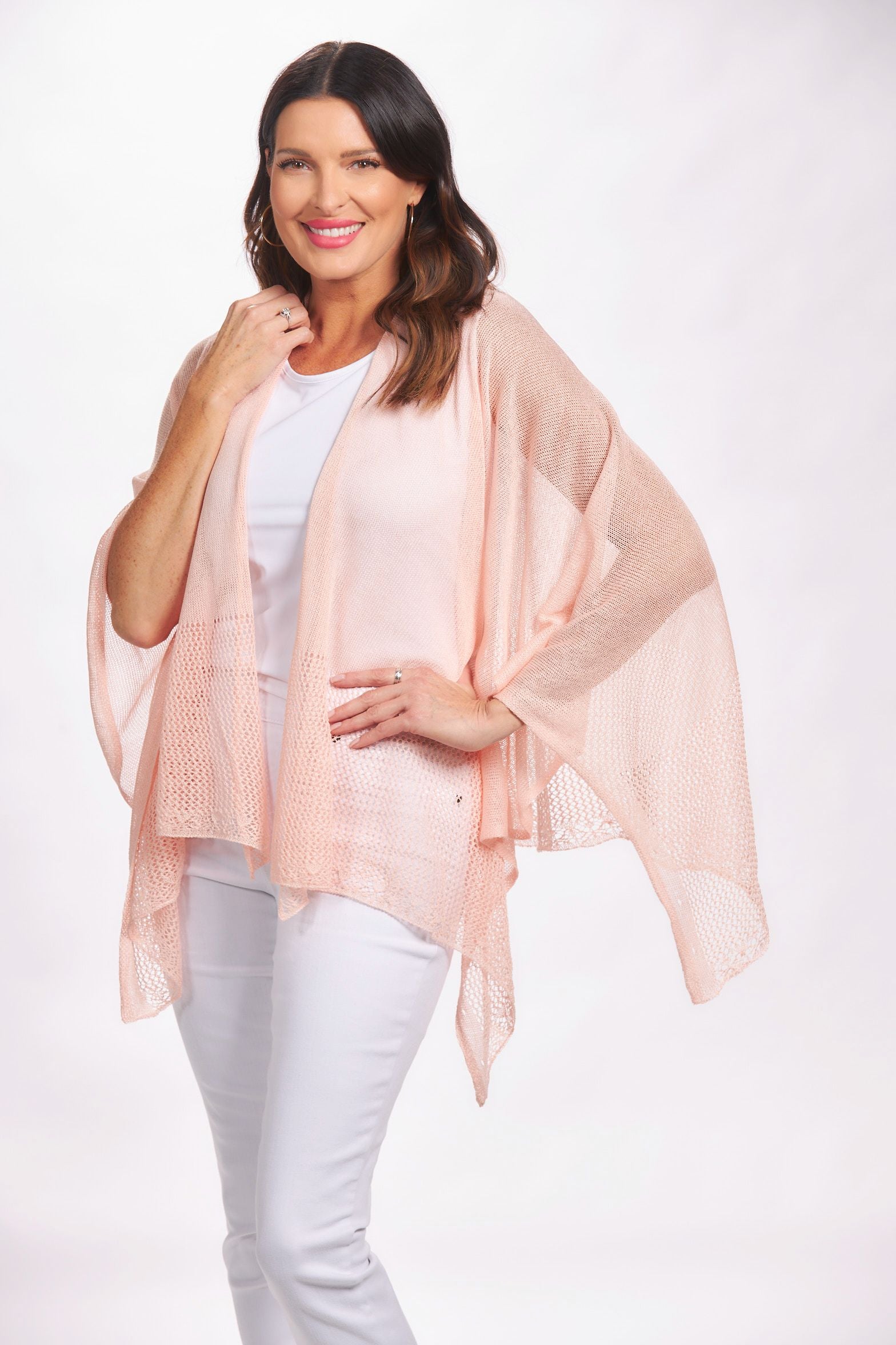 Front image of the magic scarf company lightweight ruana. Light pink shawl.