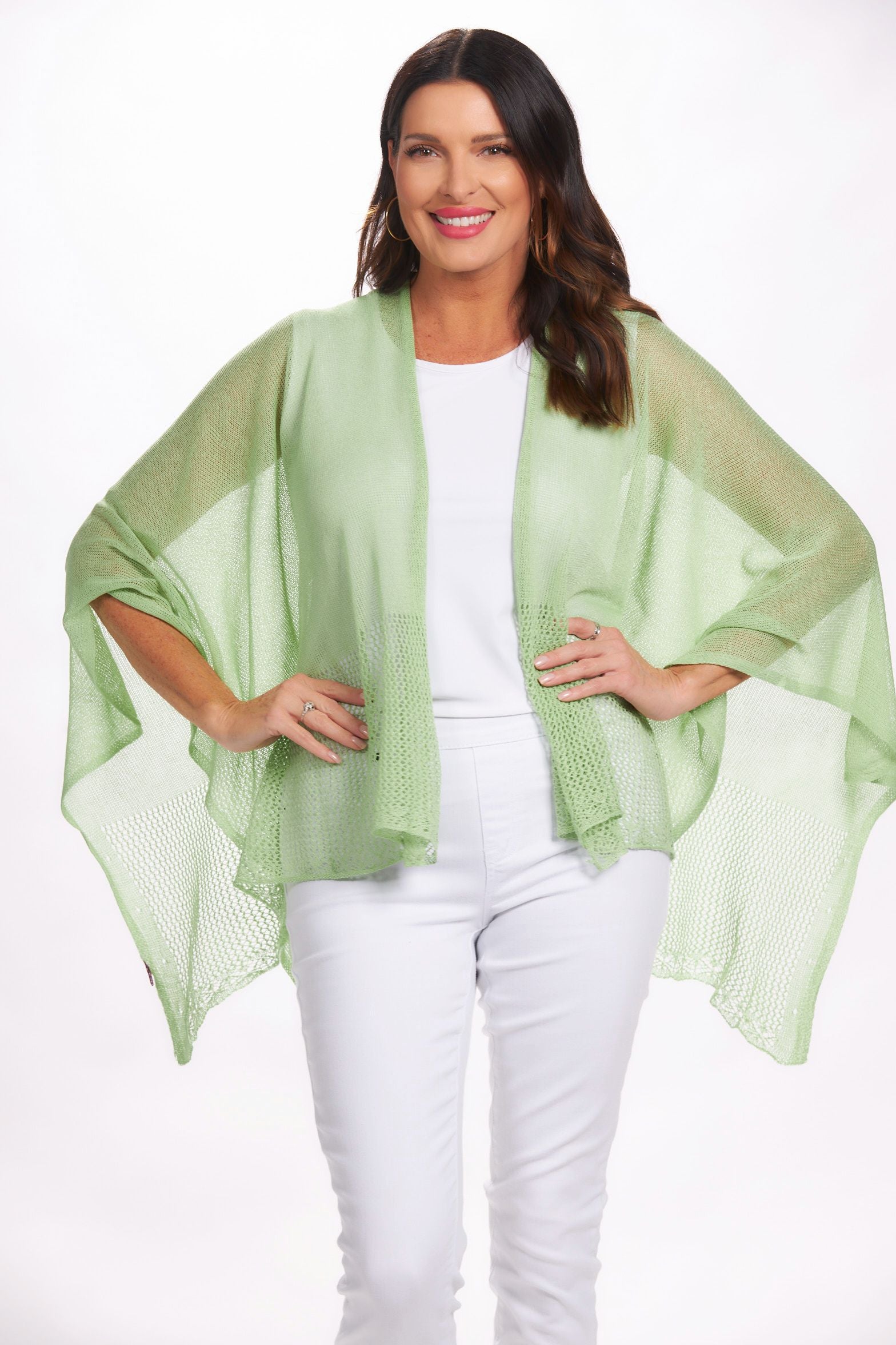 Front image of the magic scarf lightweight knit ruana. Mint green shawl.