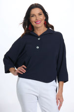 Front image of 2 button air flow shirt. Navy two button top. 