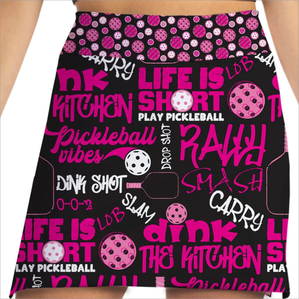Front image of Skort Obsession pickleball slam pink skort. Pull on black and pink skort.