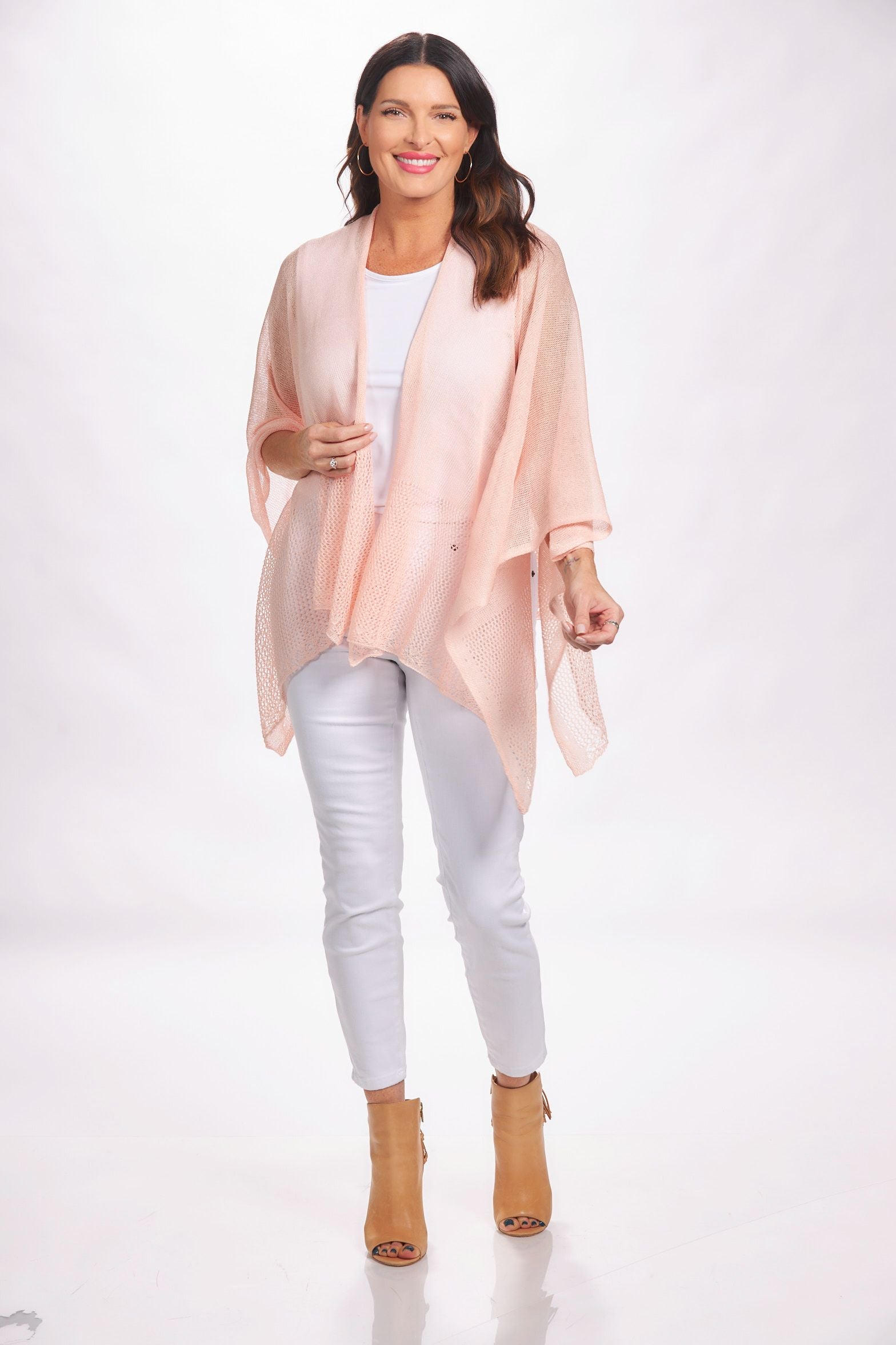 Front image of the magic scarf company lightweight ruana. Light pink shawl.