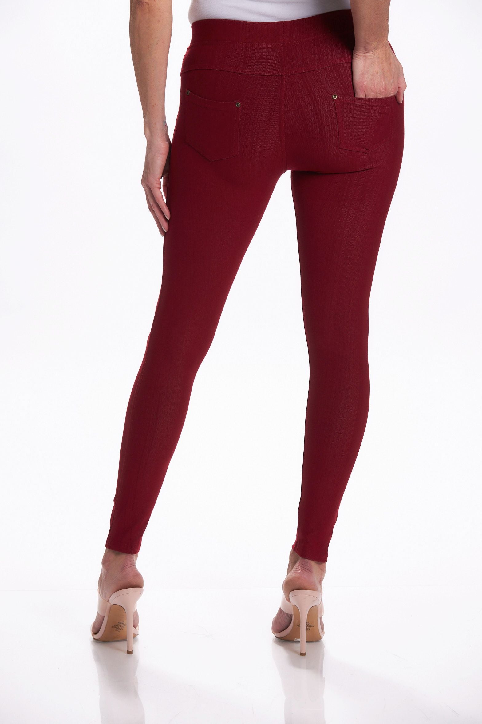 Back image of burgundy ankle denim leggings. Denim pull on leggings.