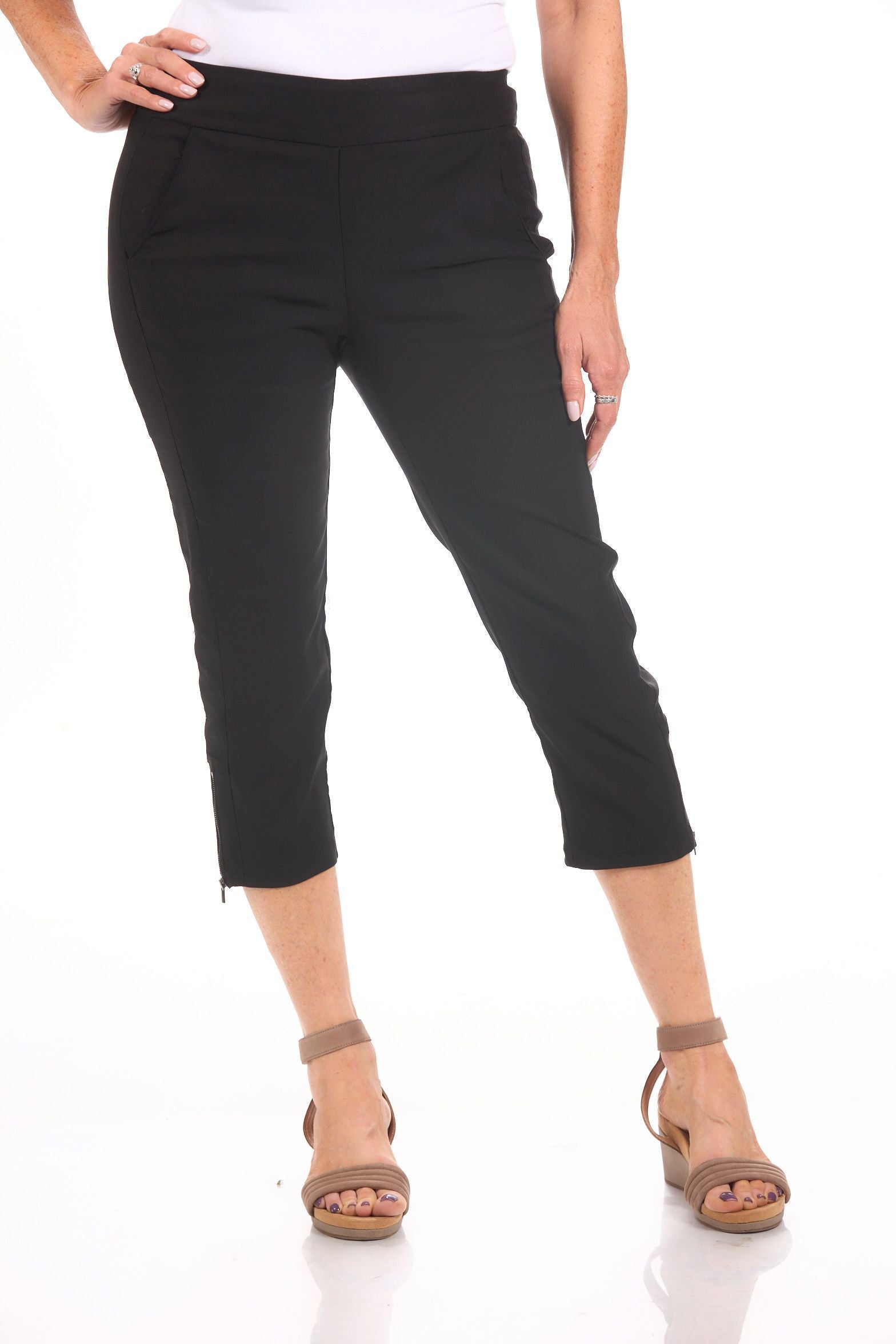 Front image of Tribal black capri with side zipper detail.