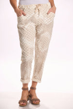Front image of Catherine Lily white pull on pants. Beige printed bottoms.