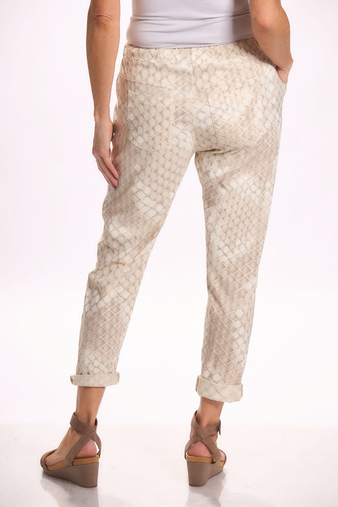 Back image of Catherine Lily white pull on pants. Beige printed bottoms.