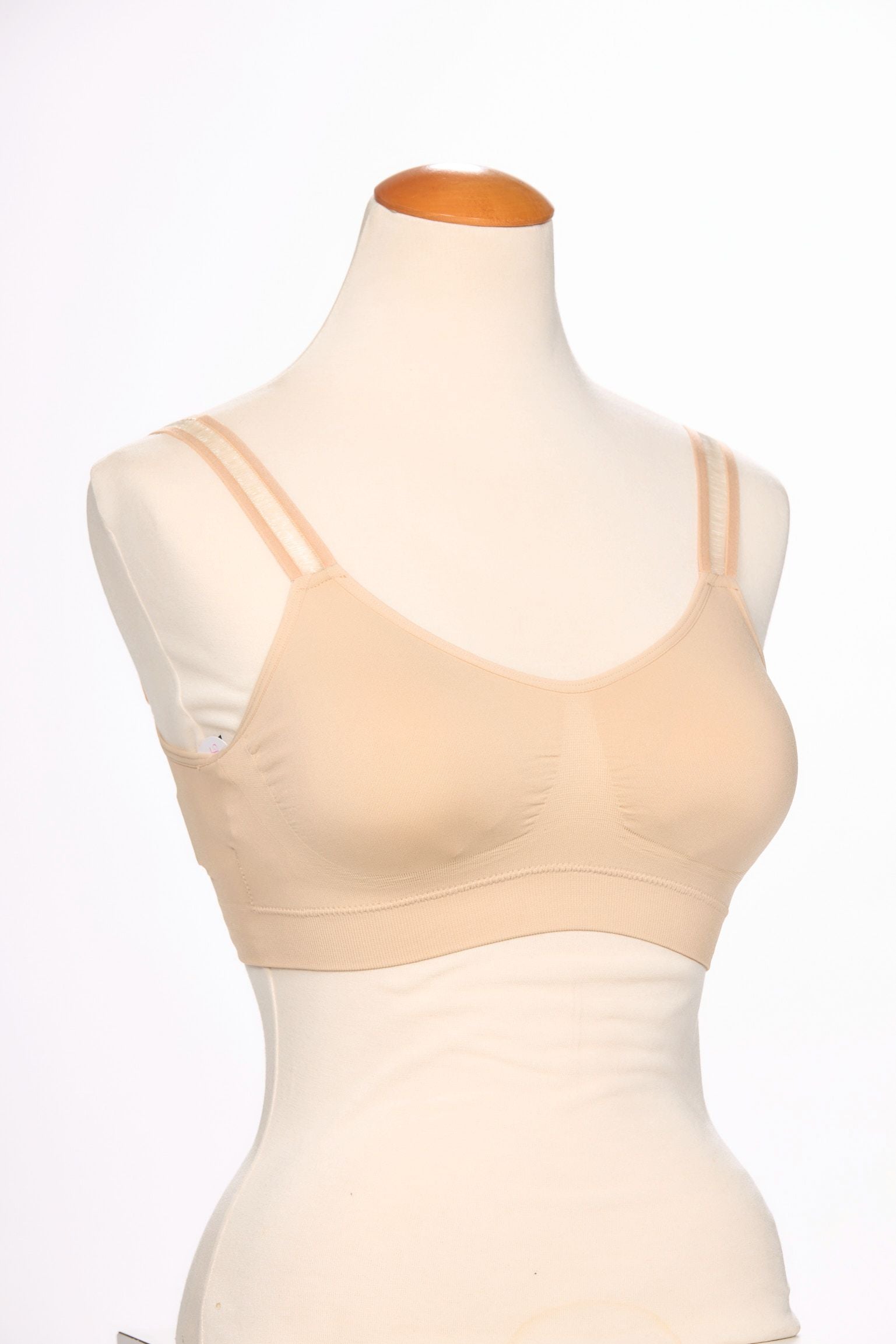 Front image of strap its bra in sheer nude.