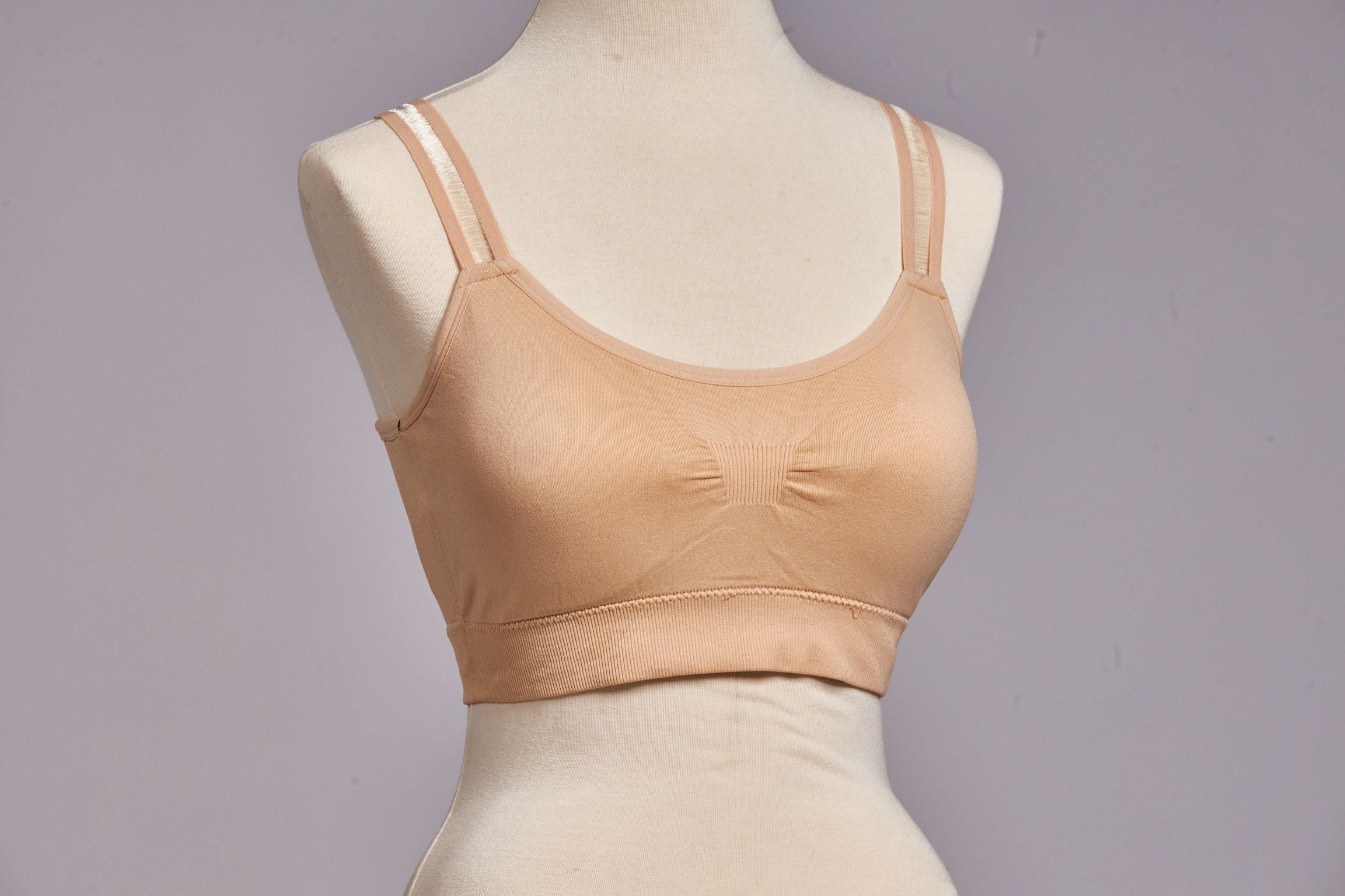 Front image of strap-its bra plus size. Nude sheer strap bra.