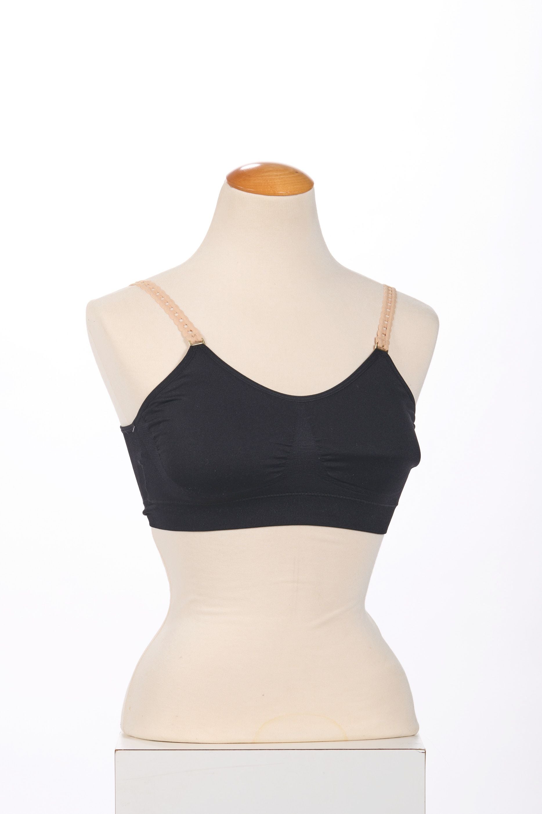 Front image of strap its bra black with nude straps.
