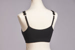 Back image of black strap its bra. Black vegan leather flower strap. 