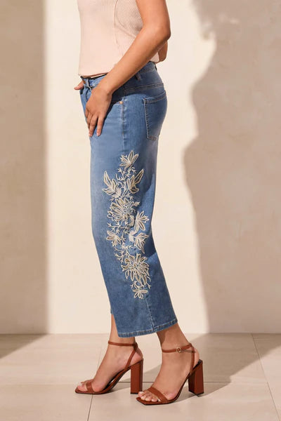 Side image of Tribal embroidered denim pant.