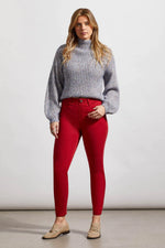 Front image of Tribal icon skinny jeans. Earth red bottoms. 