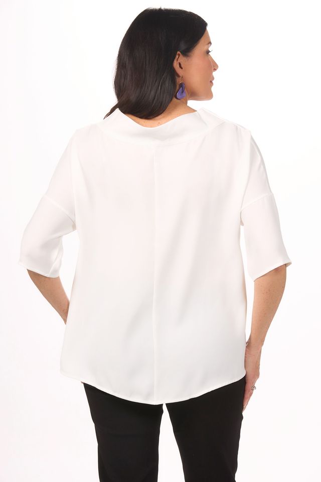 Back image of white suzy d cowl neck top.