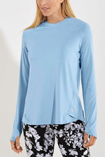 Front image of Coolibar accelera tee. Long sleeve shirt in cloud blue color. 