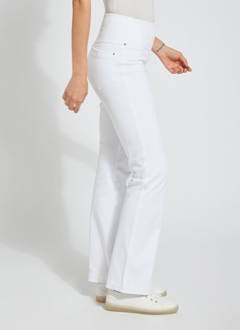 Side view of Lysse baby bootcut denim pants in white. Pull on lysse pants.