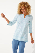 Front image of Coolibar St. Lucia Tunic Top. Blue printed tunic top. 