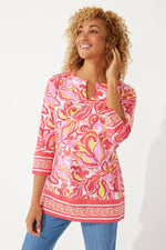 Front image of Coolibar St. Lucia Tunic Top. Coral Multicolor rio paisley printed tunic. 