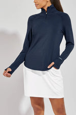 Front image of Coolibar arabella quarter zip pullover top. Navy long sleeve top. 