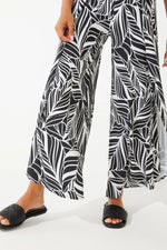 Front image of Coolibar Lynsu Wide Leg Pants. Black and white printed wide leg pants. 