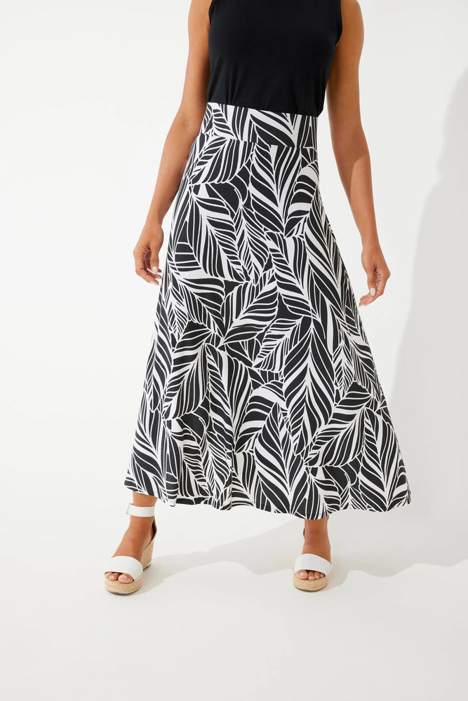 Front image of Coolibar Fabyan Maxi Skirt. Black and white coconut palm printed skirt. 