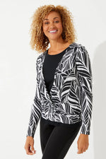 Front image of Coolibar black and white coconut palm vrae everyday fashion wrap. Long sleeve printed top. 