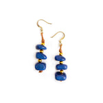 Front image of Tagua Zoraida earrings. Blue dangle handmade earrings. 