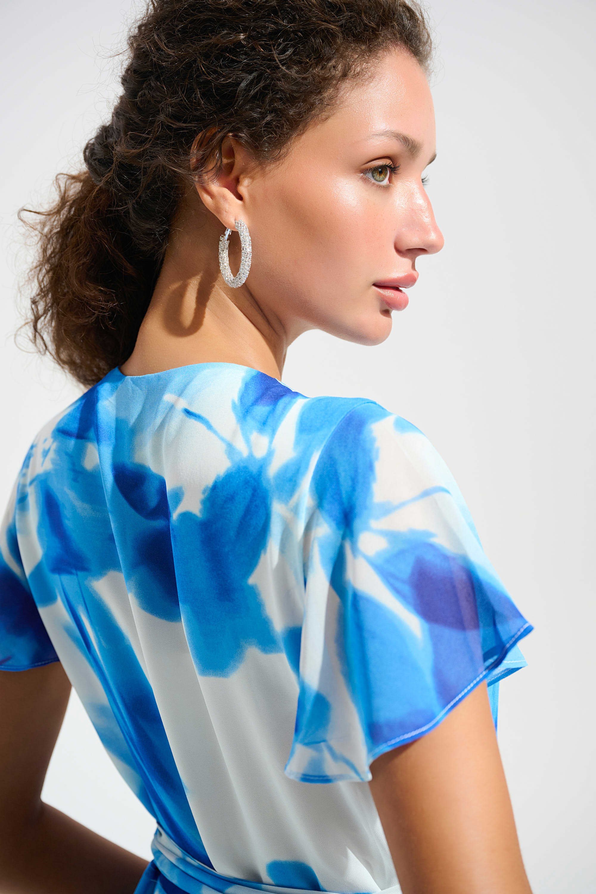 Close Up  View Image of Joseph Ribkoff  Chiffon Print Wrap Dress With Ruffle Detail in Vanilla/Blue