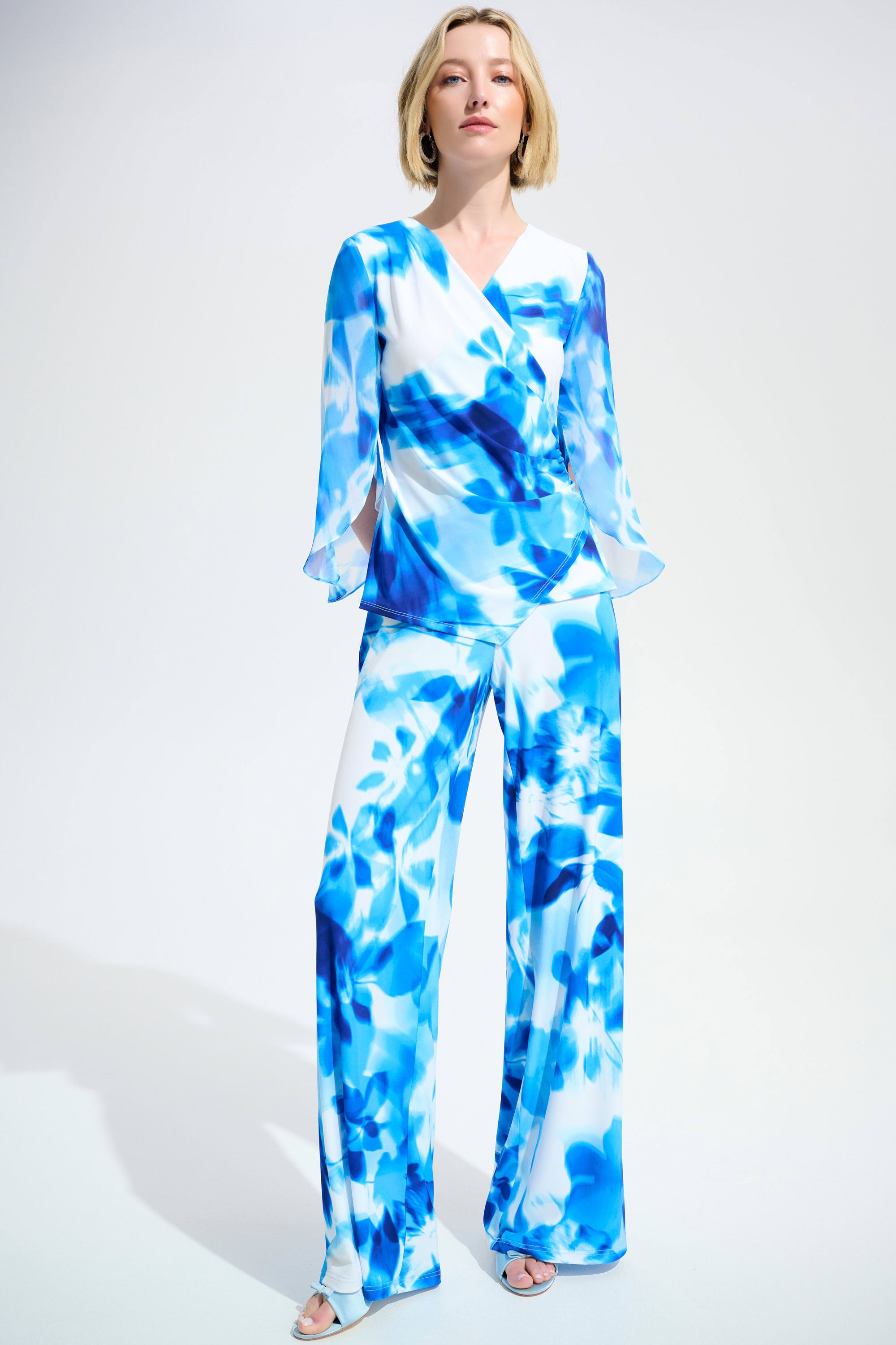 Full Body View Of Joseph Ribkoff  Silky Knit Floral Print Wide Leg Pants in Vanilla/Blue