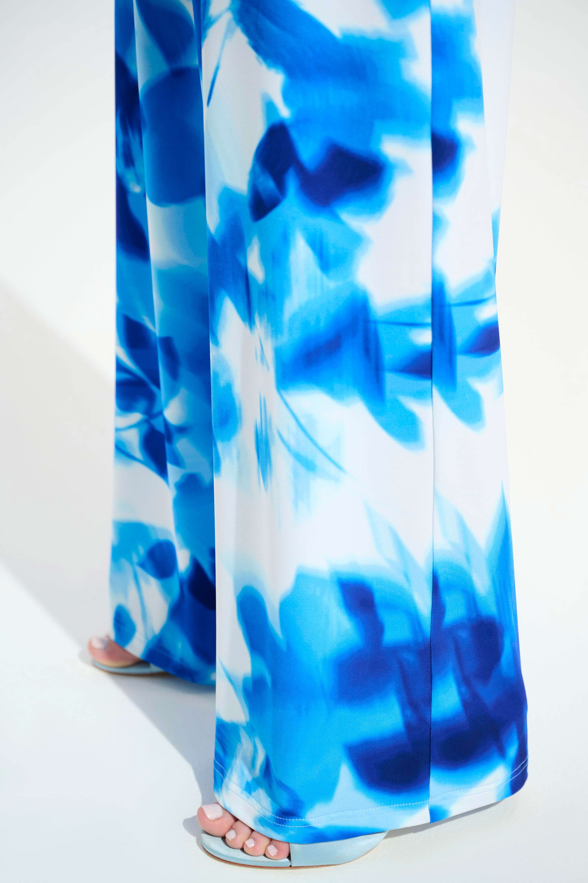 Close Up View Of Joseph Ribkoff  Silky Knit Floral Print Wide Leg Pants in Vanilla/Blue