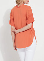 Back image of Lysse Stevie Top in vibrant apricot. Short sleeve fashion top. 