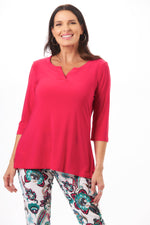Front image of hot pink 3/4 sleeve split neck tunic