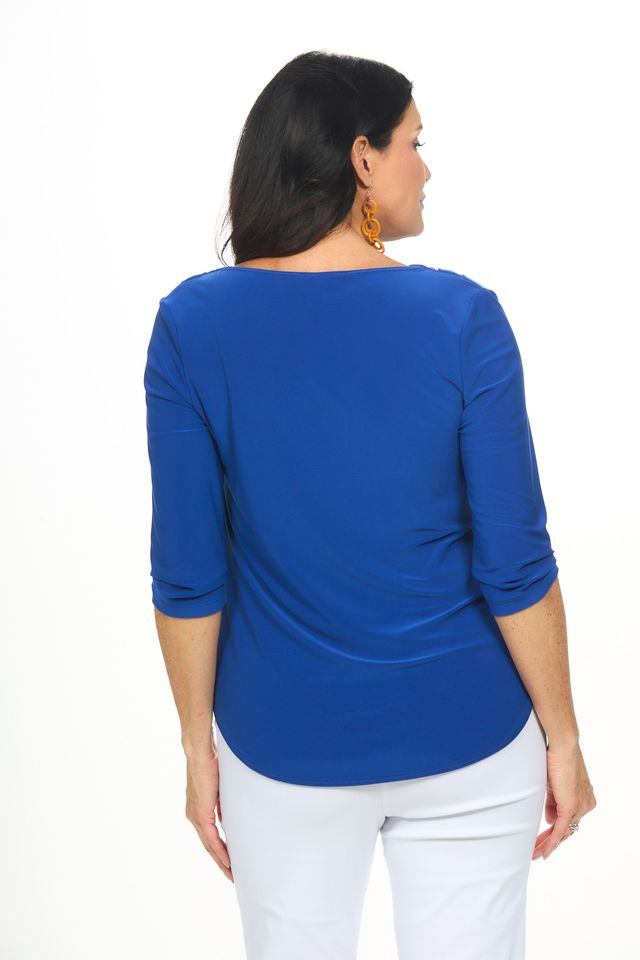 Back image of royal blue cowl neck top.