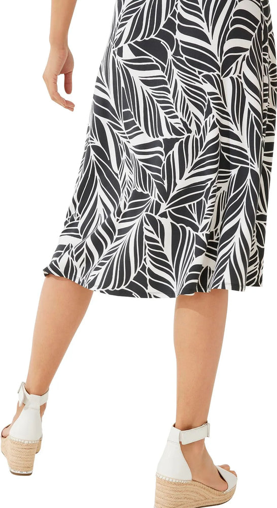 Back image of Coolibar Marigot Midi Skirt. Black and white printed skirt. 