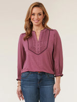 Front image of Democracy 3/4 sleeve blouson embroidered top. Embroidered tunic top. 