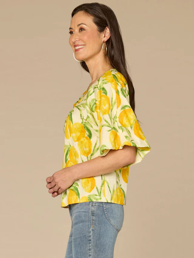 Side View Image of Democracy Bubble Bell Sleeve V-Neck Print Top in Leon Lush Multi