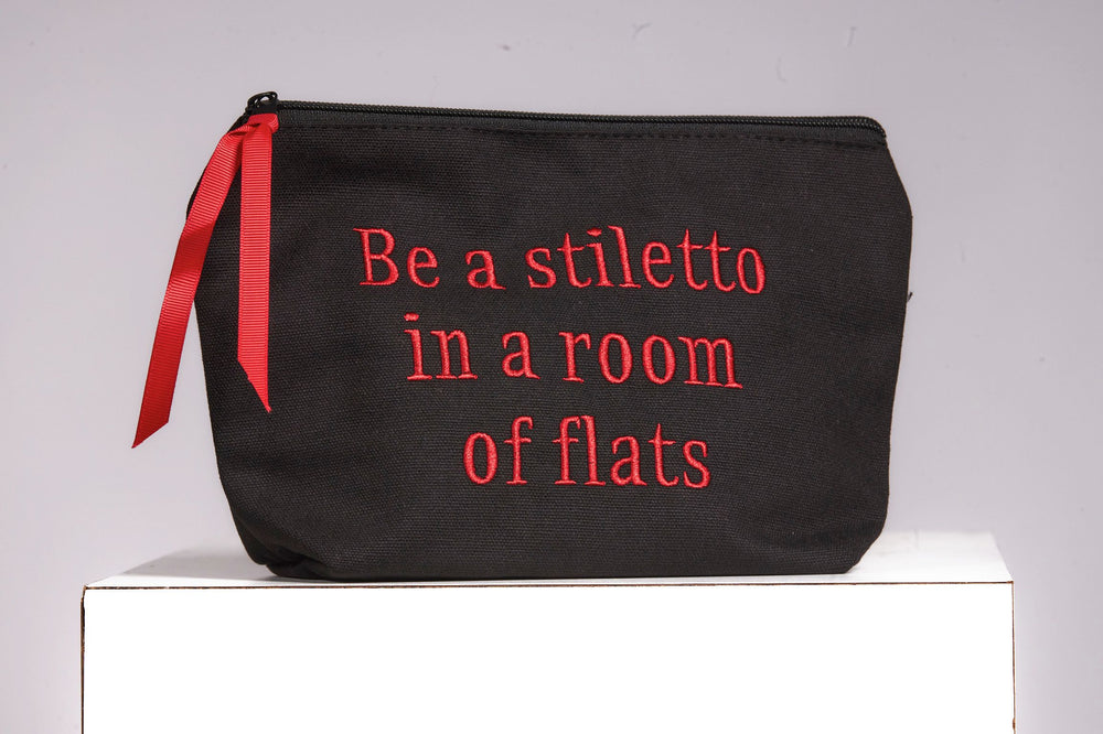 Front image of Cosmetic bags. Be a stiletto in a room of flats bag. 