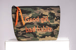 Front image of cosmetic bag. Good girl, bad habits. 
