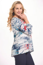 Side image of parsley and sage crossover hem top. Navy and blue printed top. 